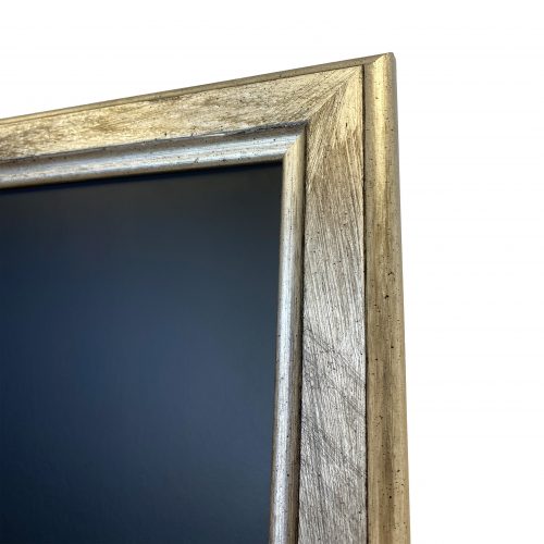 Closeup of the a chalkboard frame in a silver scratch-effect finish