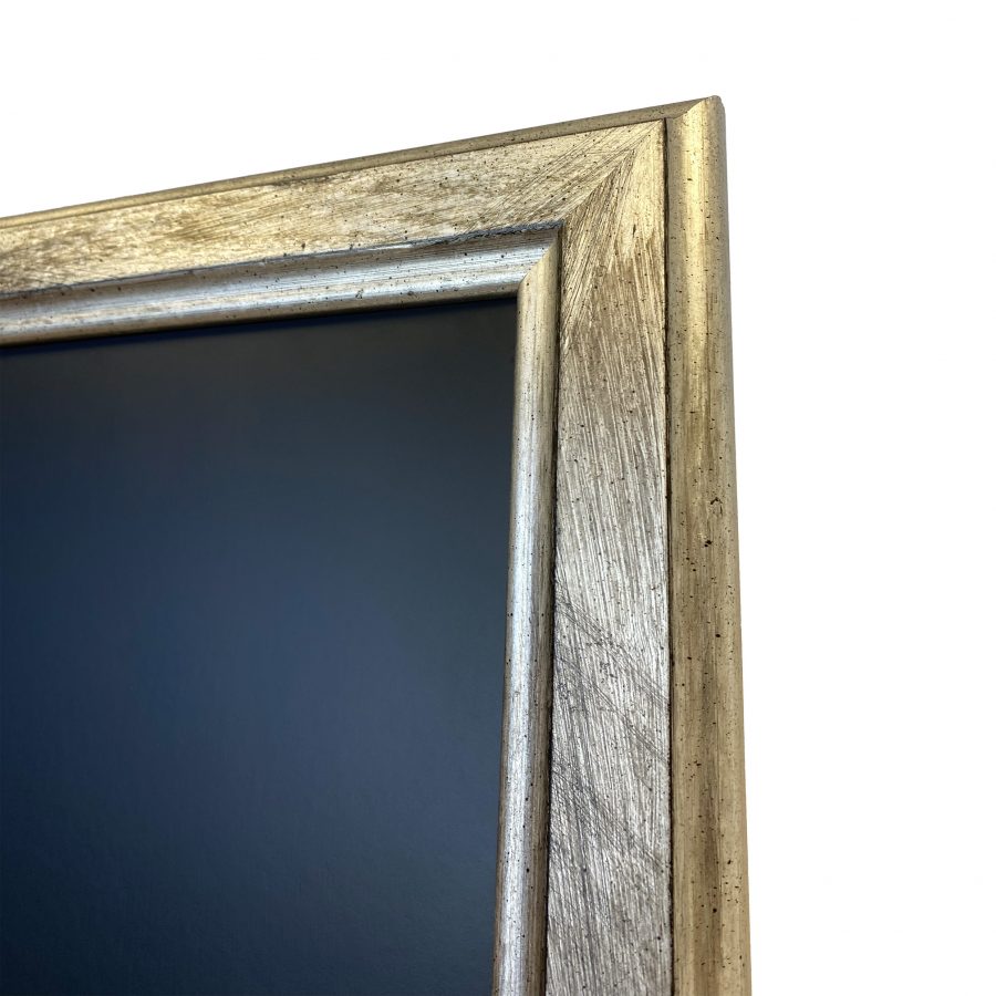 Closeup of the a chalkboard frame in a silver scratch-effect finish
