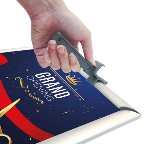 A hand opening a snapframe