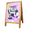 Pavement sign with side-loading poster insert design finished with pine frame and printed display