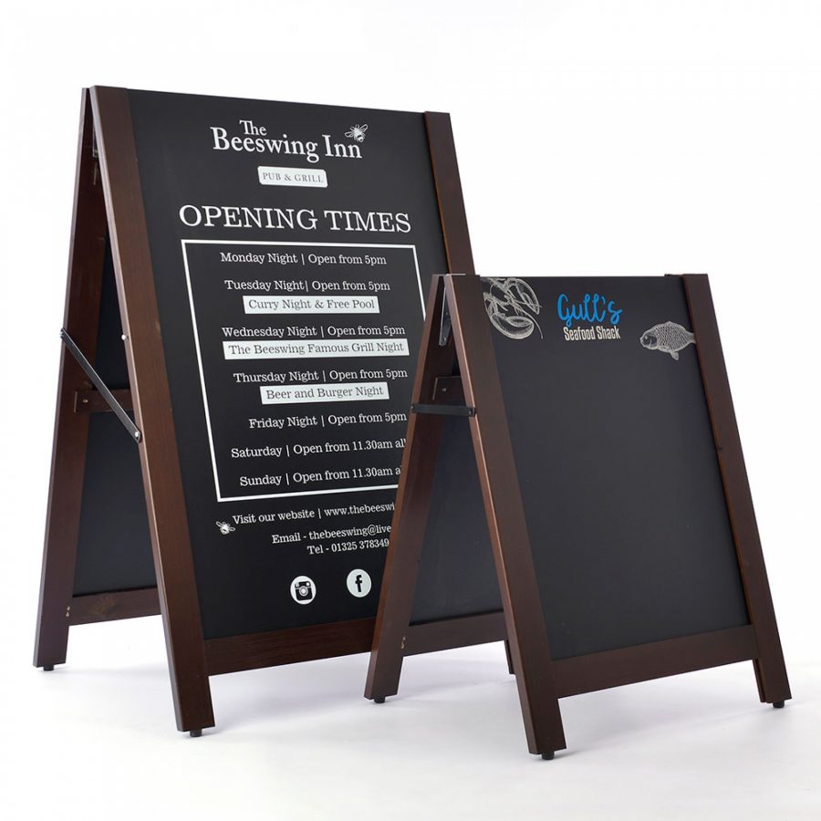 Pavement sign with chalkboards that slot out and can be reversed