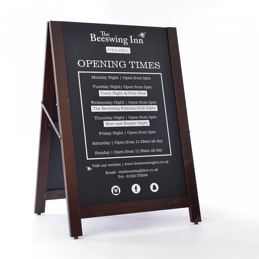 Pavement sign with chalkboards that slot out and can be reversed showing optional printed side