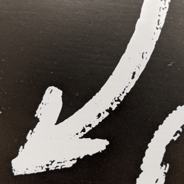 closeup of white printed ink to look like handwriting closeup of white printed ink to look like handwriting