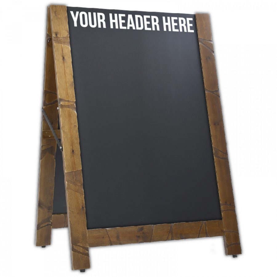 A wooden pavement sign with chalkboard boards that are reversible