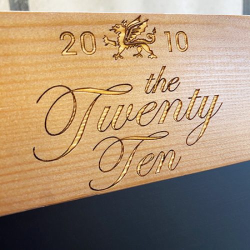 Emblem headed A-board closeup of header engraving logo