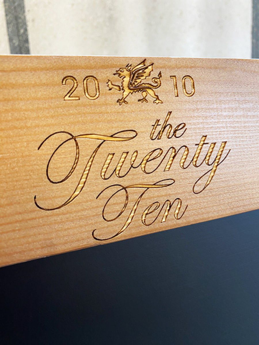 Emblem headed A-board closeup of header engraving logo