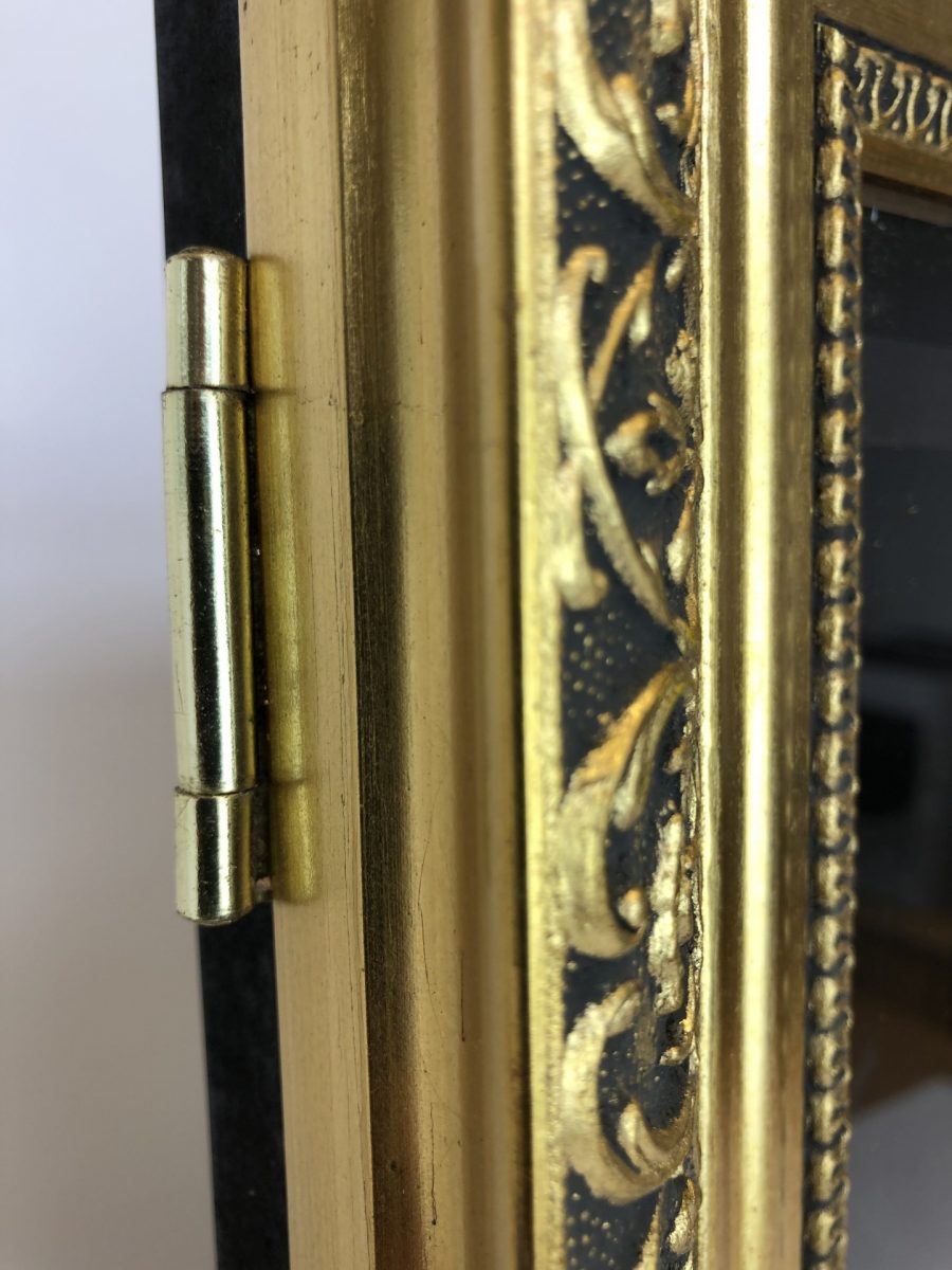 Wooden poster frame with gold frame closeup of detail