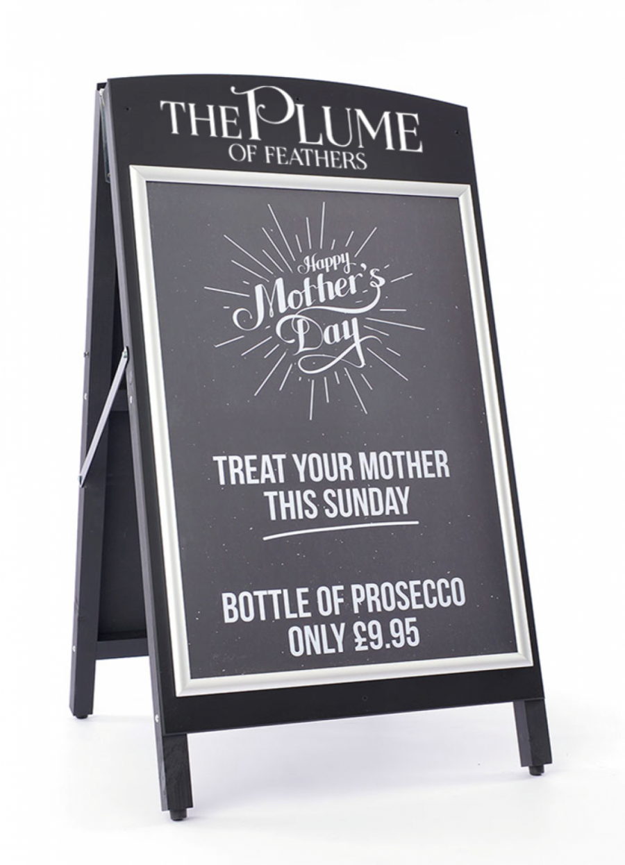 A black pavement sign with snapframe displaying a offers from a local business