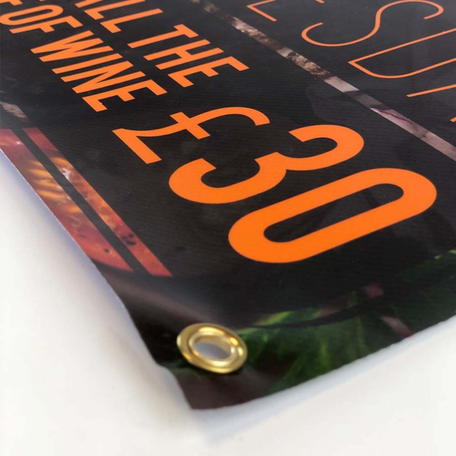 A vinyl printed banner with brass eyelets for fixing