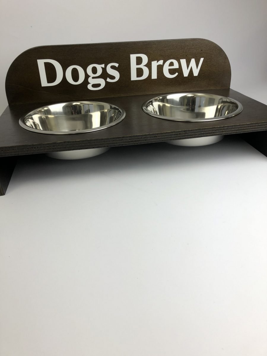 A raised dog bowl wooden holder