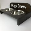 A raised dog bowl wooden holder