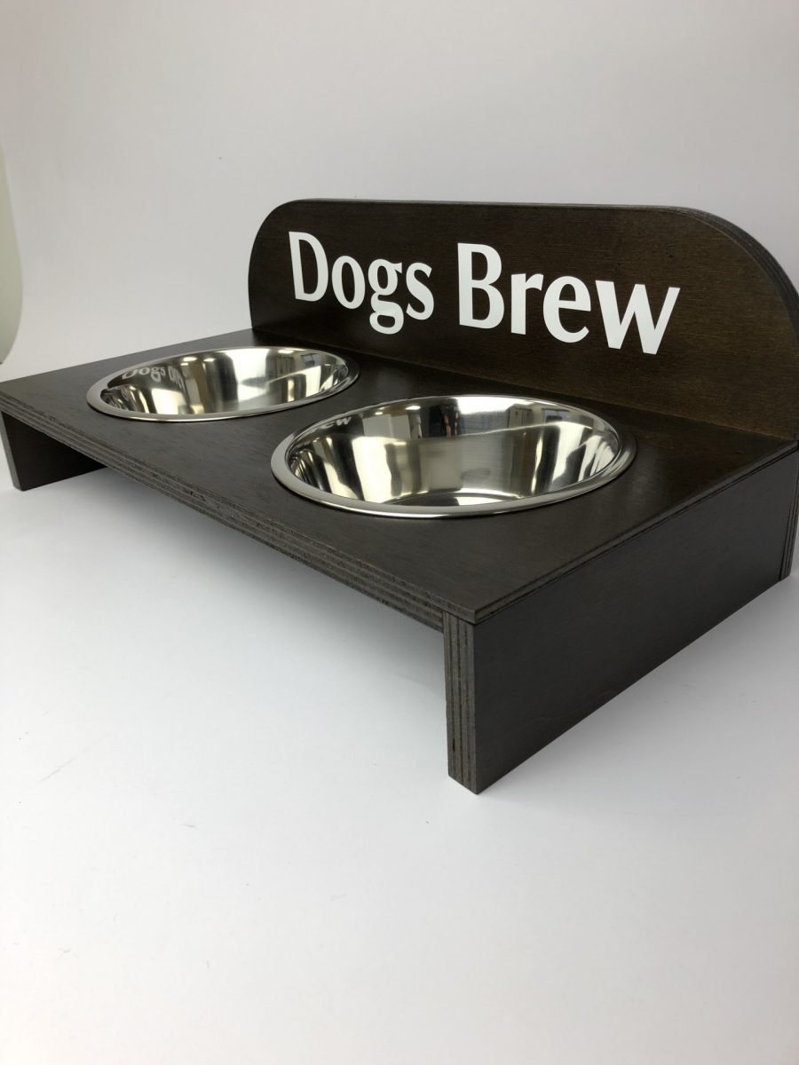 A raised dog bowl wooden holder