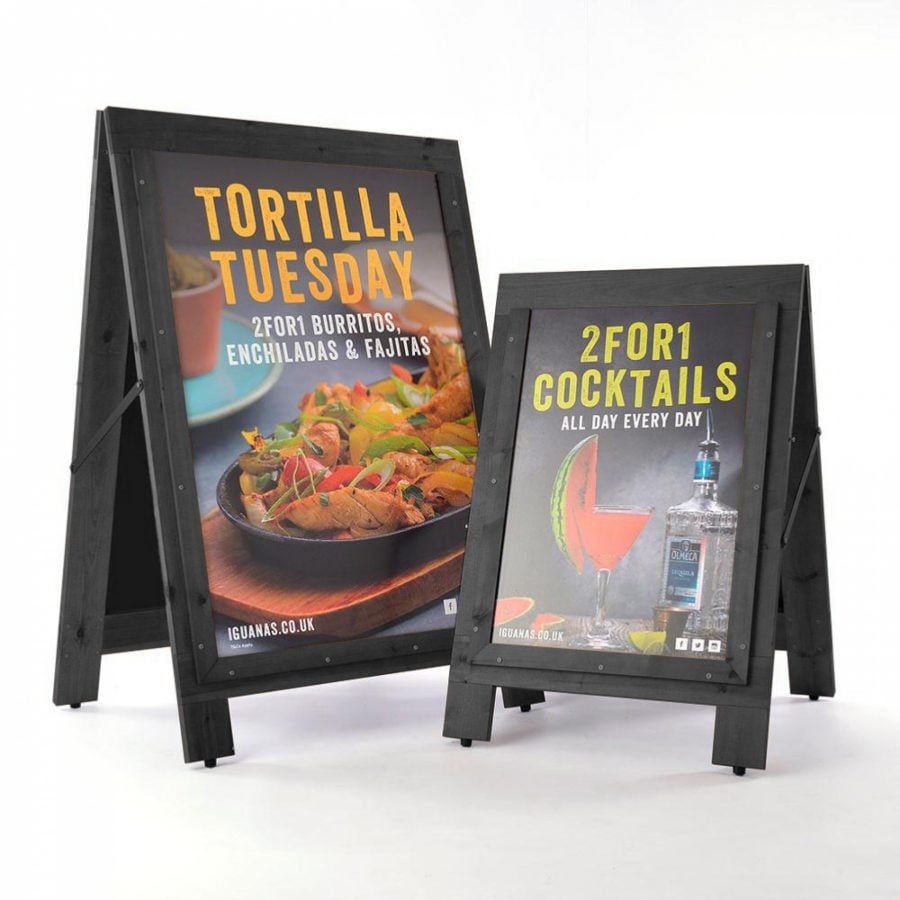 2 wooden pavement signs with printed displayed that can be reversed