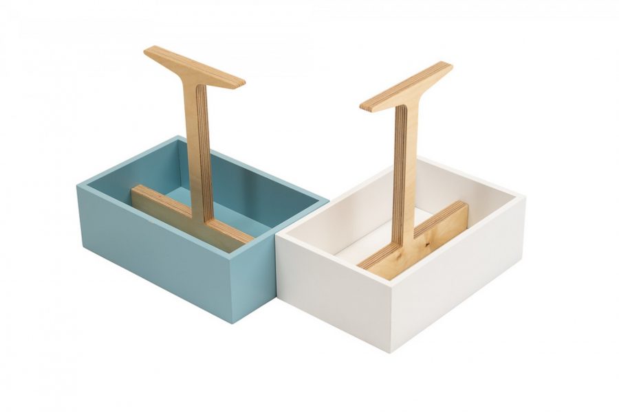 A painted wooden box holding condiments natural wood handle