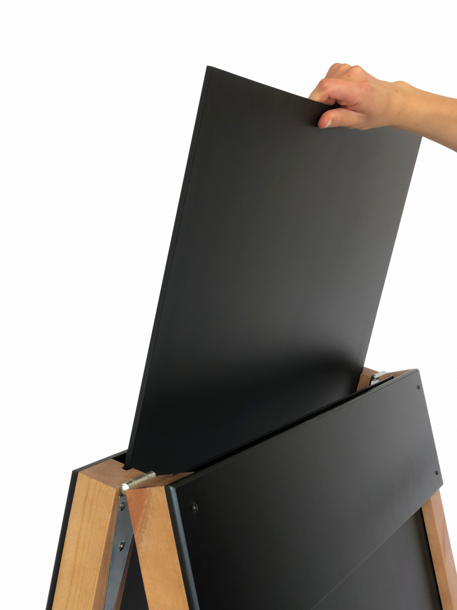 Reverisble insert wooden a-frame pavement sign with person removing the insert easily
