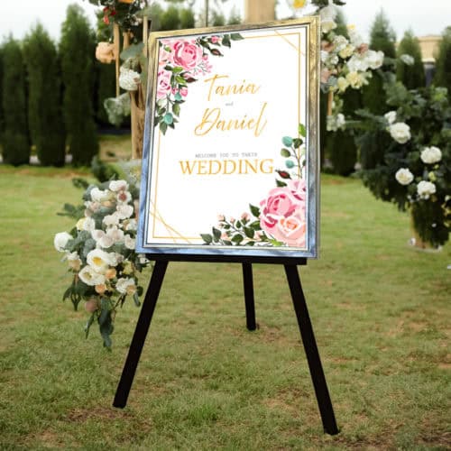 large wedding easel with pretty flowers on it