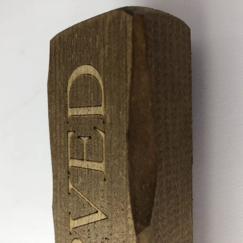 A wooden block with Reserved engraved for table reservations